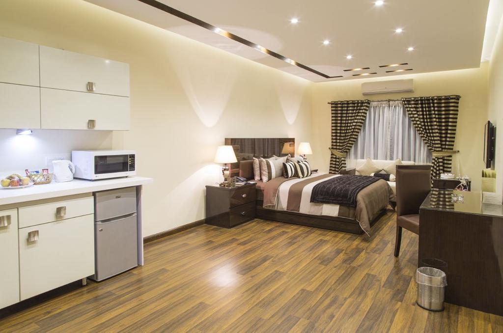 Royaute Luxury Suites And Hotel Gulberg Lahore Habitación foto